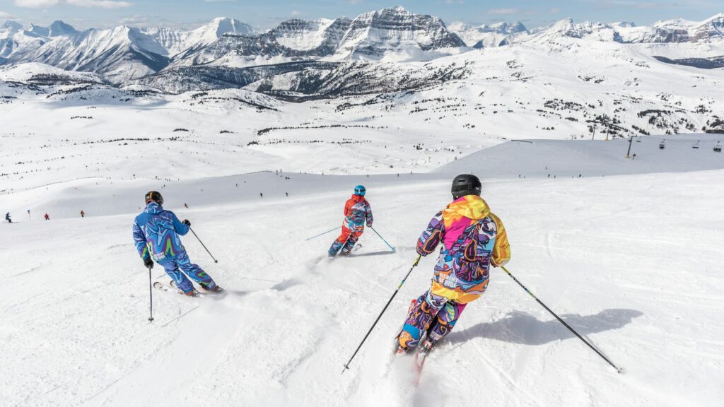 Skiers on a snowy mountain slope at Revelstoke